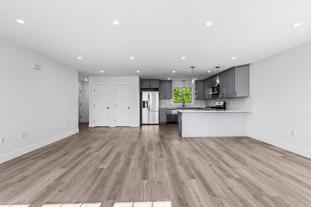47 Parker St Unit 3, Quincy, MA 02169 - kitchen with stainless steel appliances, gray cabinetry, light countertops, recessed lighting, and open floor plan