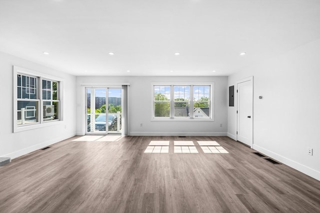 47 Parker St Unit 3, Quincy, MA 02169 - unfurnished living room featuring wood finished floors, recessed lighting, and electric panel