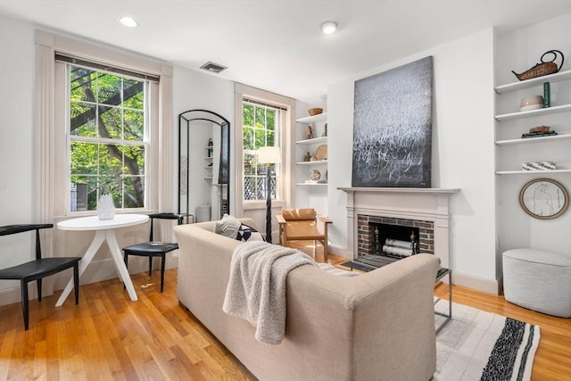 3 Melrose St Unit 3, Boston, MA 02116 - living area featuring light wood-style floors, a fireplace, and recessed lighting