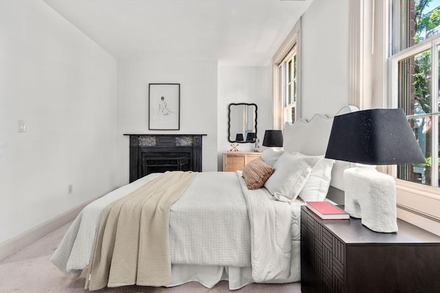 3 Melrose St Unit 3, Boston, MA 02116 - carpeted bedroom with multiple windows, a fireplace, and baseboards