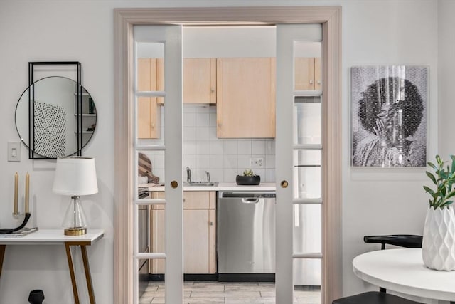 3 Melrose St Unit 3, Boston, MA 02116 - kitchen featuring dishwasher, light brown cabinetry, backsplash, light countertops, and a sink
