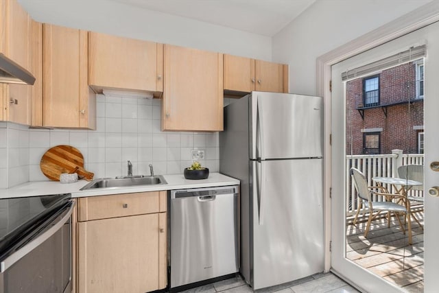 3 Melrose St Unit 3, Boston, MA 02116 - kitchen featuring stainless steel appliances, a sink, light countertops, light brown cabinetry, and decorative backsplash