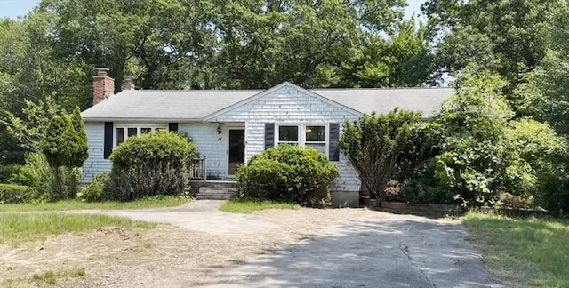 11 Glenwood St, Whitman, MA 02382 - view of front of home with a chimney and view of wooded area
