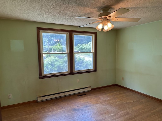 11 Glenwood St, Whitman, MA 02382 - unfurnished room featuring baseboard heating, wood finished floors, a textured ceiling, and ceiling fan