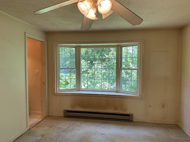 11 Glenwood St, Whitman, MA 02382 - carpeted spare room featuring a baseboard heating unit, plenty of natural light, a textured ceiling, and ceiling fan