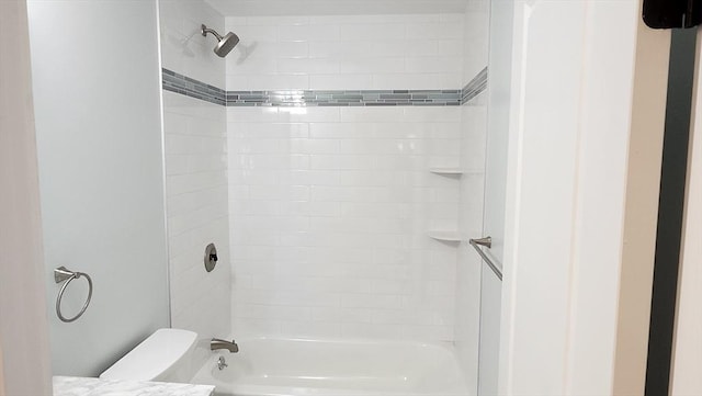 bathroom with toilet and shower / washtub combination
