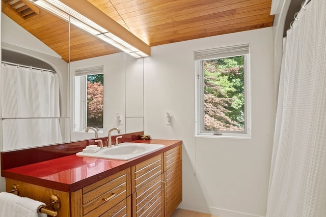 bathroom with lofted ceiling, wooden ceiling, and vanity