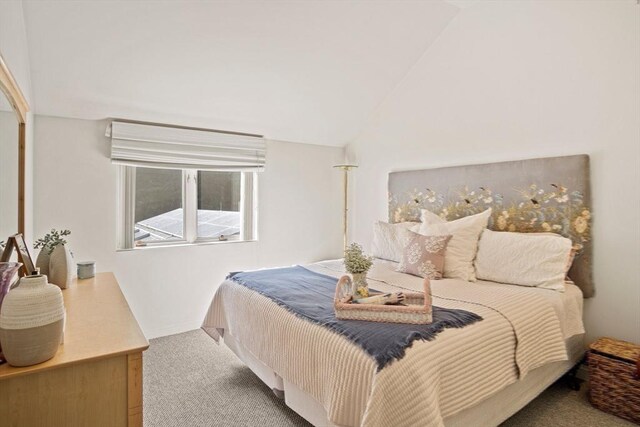 living room featuring light colored carpet, wood walls, and beam ceiling