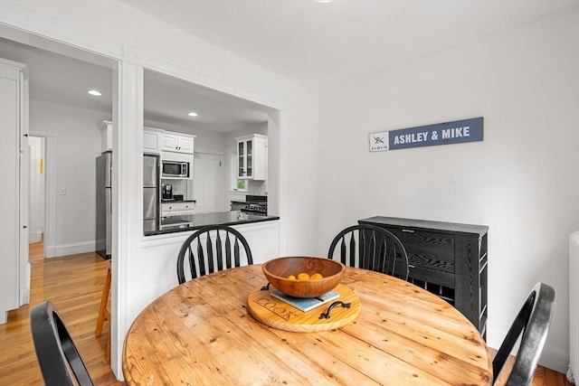 115 Elm St, Andover, MA 01810 - dining room with light wood finished floors and recessed lighting