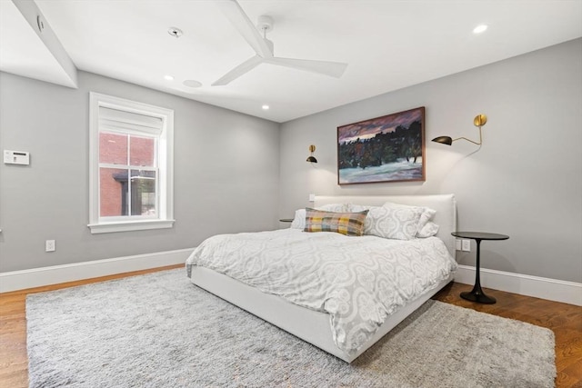 bedroom featuring baseboards, wood finished floors, a ceiling fan, and recessed lighting