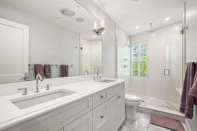 bathroom with marble look tiles, a stall shower, toilet, double vanity, and recessed lighting