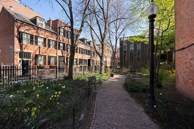 view of home's community with fence