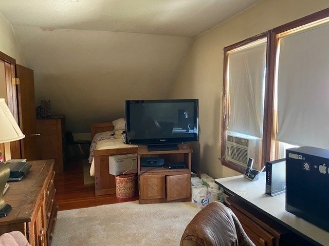 living room with lofted ceiling and light wood-type flooring