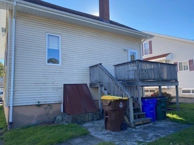 back of property with a wooden deck