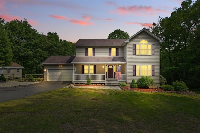 315 Woodland Way, Russell, MA 01071 - traditional home featuring covered porch, driveway, a garage, and a front lawn
