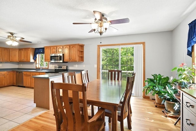 315 Woodland Way, Russell, MA 01071 - dining space featuring ceiling fan and light wood-type flooring