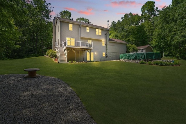 315 Woodland Way, Russell, MA 01071 - back of property featuring stairs, a wooden deck, and a lawn