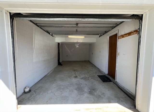 80 Smith St Unit 2A, Lowell, MA 01851 - garage featuring concrete block wall