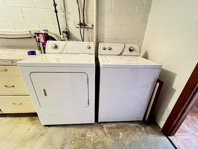 80 Smith St Unit 2A, Lowell, MA 01851 - laundry room featuring washing machine and dryer and concrete block wall