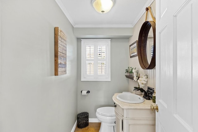 28 Manomet Beach Blvd, Plymouth, MA 02360 - half bath featuring toilet, vanity, baseboards, and crown molding