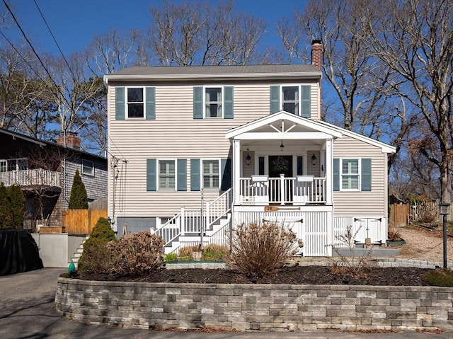 28 Manomet Beach Blvd, Plymouth, MA 02360 - view of front of property with covered porch, a chimney, and stairway