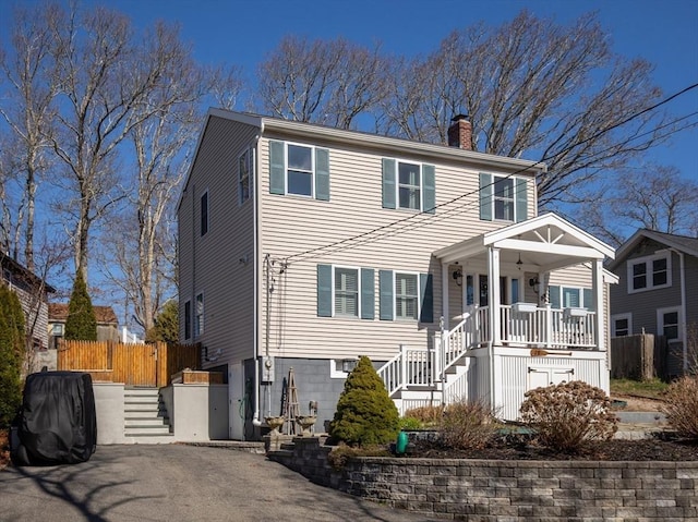 28 Manomet Beach Blvd, Plymouth, MA 02360 - view of front of house with stairs, covered porch, and a chimney