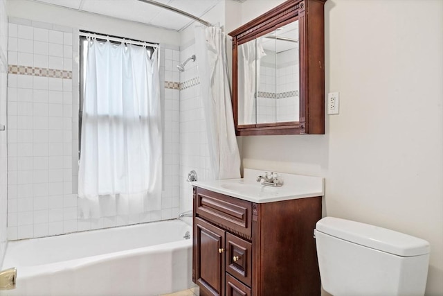 full bathroom featuring vanity, shower / tub combo with curtain, and toilet