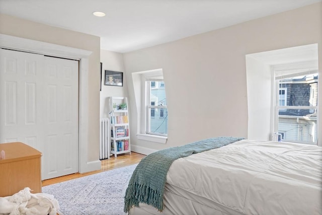 bedroom featuring hardwood / wood-style flooring and a closet