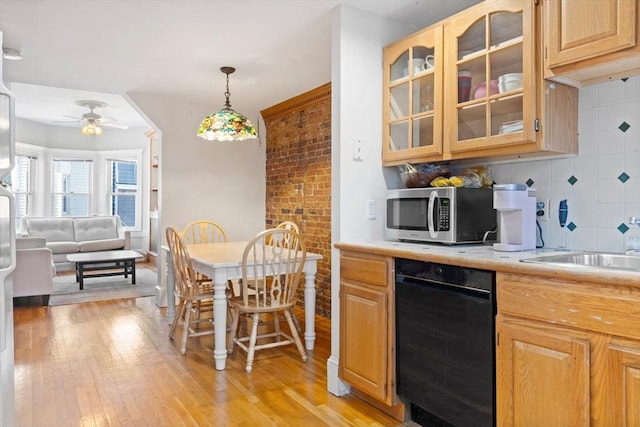 kitchen featuring light hardwood / wood-style flooring, ceiling fan, tasteful backsplash, decorative light fixtures, and light brown cabinets