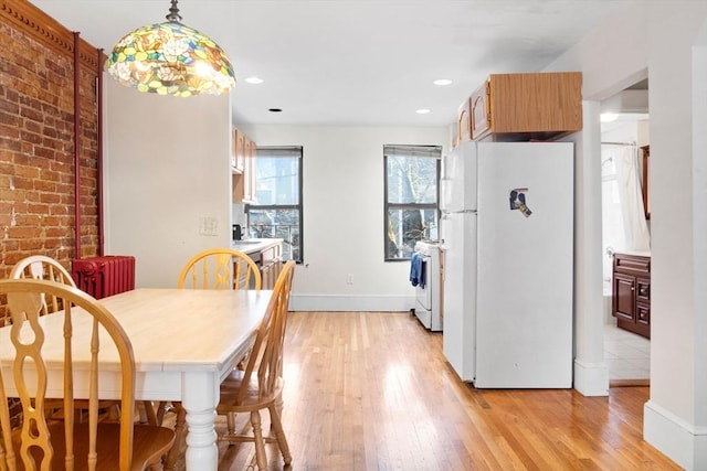 dining space featuring light hardwood / wood-style floors