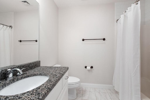 bathroom featuring vanity, a shower with shower curtain, and toilet