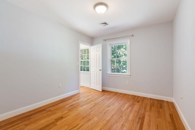 empty room with light wood-type flooring