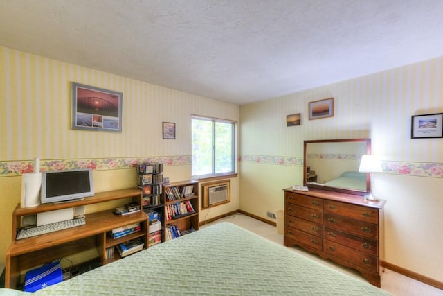 carpeted bedroom featuring wallpapered walls, a wall unit AC, and baseboards