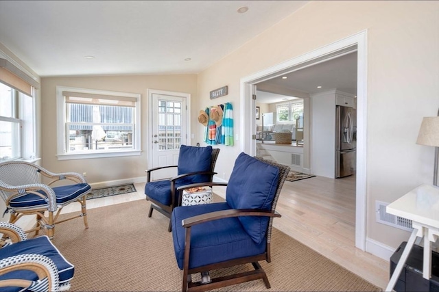 sunroom featuring a healthy amount of sunlight and visible vents