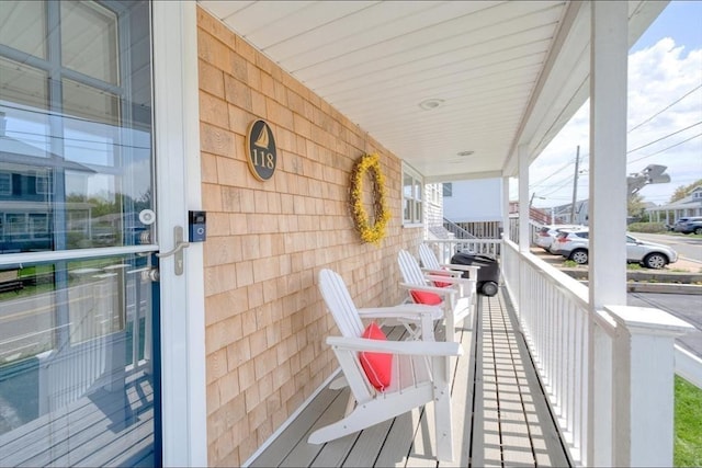 balcony featuring a porch