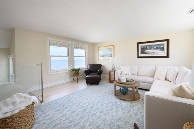 118 Oceanside Dr, Scituate, MA 02066 - living room with baseboards and wood finished floors