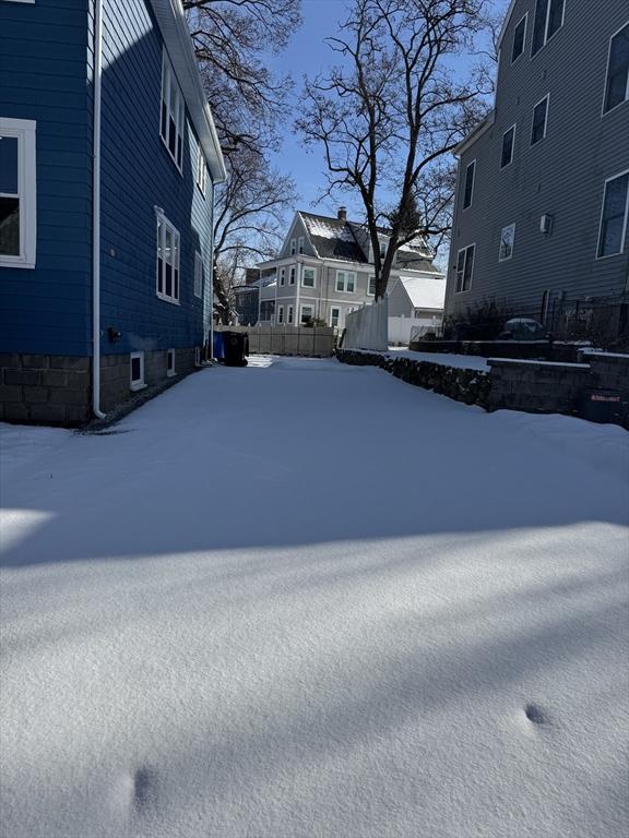 view of yard covered in snow