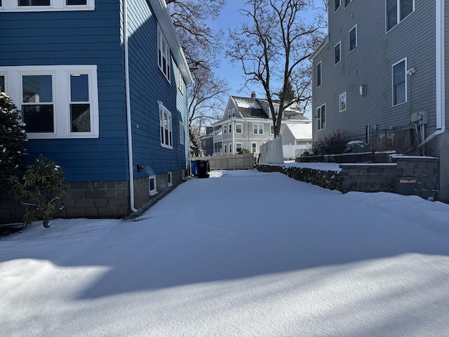 view of yard layered in snow