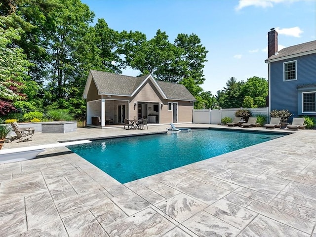 view of pool with a patio, a storage structure, an outdoor structure, fence, and a fenced in pool