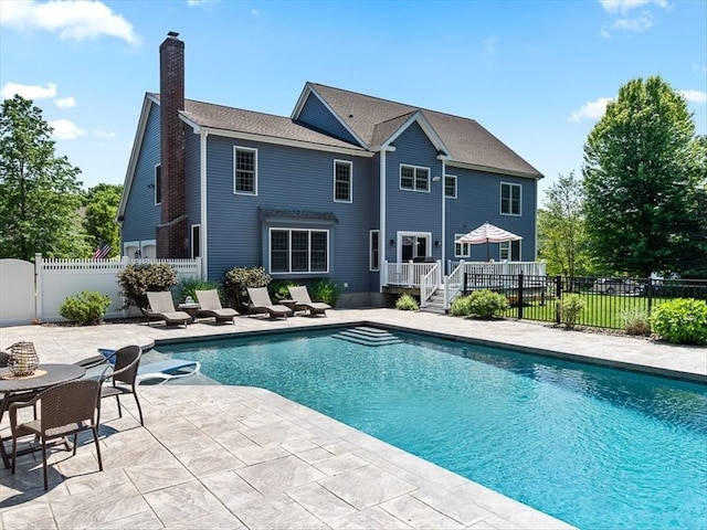 view of pool featuring a patio area