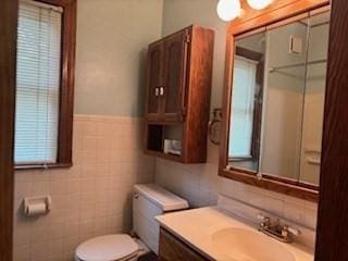 1774 Carew St, Springfield, MA 01104 - bathroom featuring toilet, vanity, and tile walls