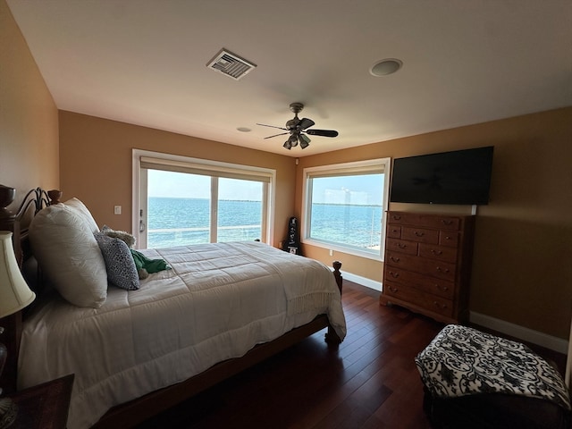 bedroom featuring access to exterior, ceiling fan, and dark hardwood / wood-style floors