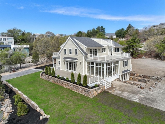 220 Atlantic St, Gloucester, MA 01930 - back of property with a balcony, a lawn, and a patio