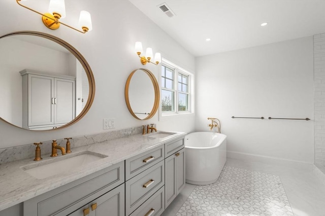 220 Atlantic St, Gloucester, MA 01930 - full bath featuring a freestanding tub, double vanity, baseboards, and recessed lighting