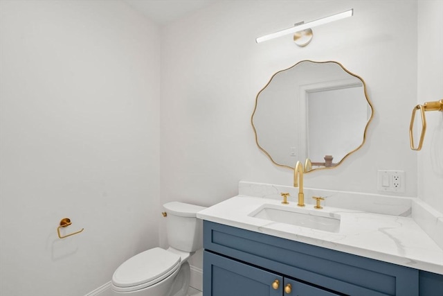 220 Atlantic St, Gloucester, MA 01930 - half bathroom with vanity, baseboards, and toilet