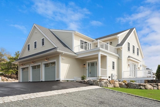 220 Atlantic St, Gloucester, MA 01930 - traditional-style home with a balcony, a garage, driveway, and roof with shingles