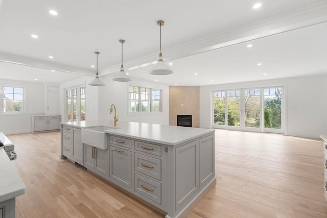 220 Atlantic St, Gloucester, MA 01930 - kitchen featuring a sink, open floor plan, gray cabinets, light countertops, and recessed lighting