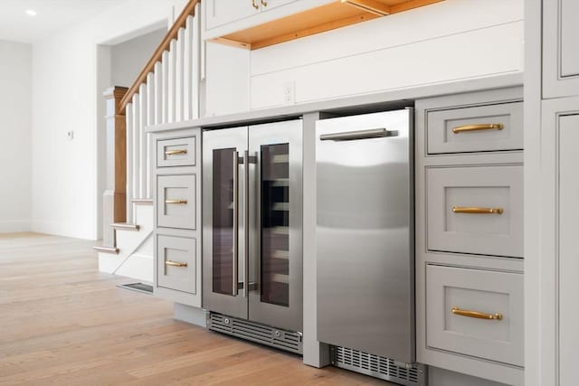 220 Atlantic St, Gloucester, MA 01930 - detailed view of beverage cooler, wood finished floors, recessed lighting, and baseboards