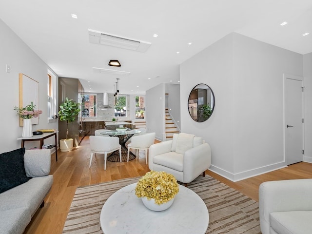 living room with light hardwood / wood-style floors