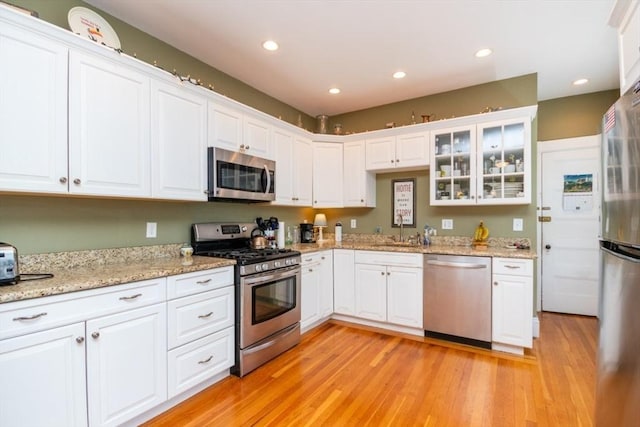 18 Dighton St Unit 18, Boston, MA 02135 - kitchen featuring stainless steel appliances, a sink, white cabinetry, and recessed lighting